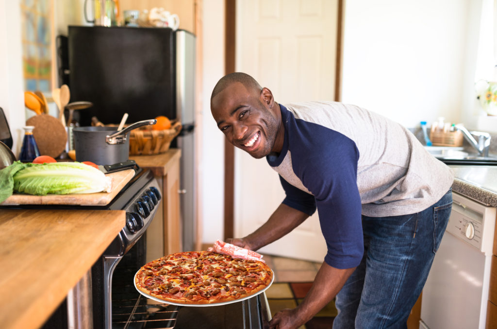 take and bake pizza guy smiling standout franchise