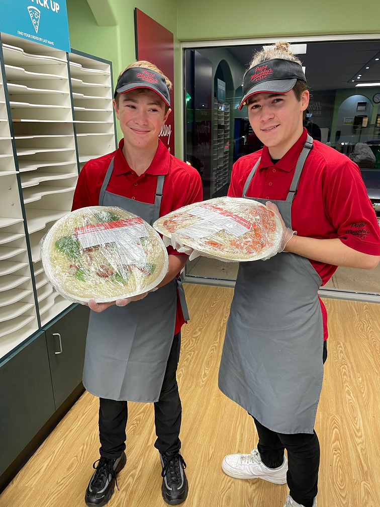 Employee Satisfaction holding pizzas